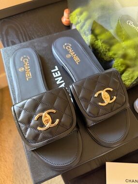 CHANEL Black Turn Lock Quilted Leather Slides